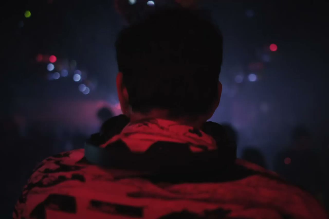 A wide rooftop performance at night with city lights behind, AI music video scene