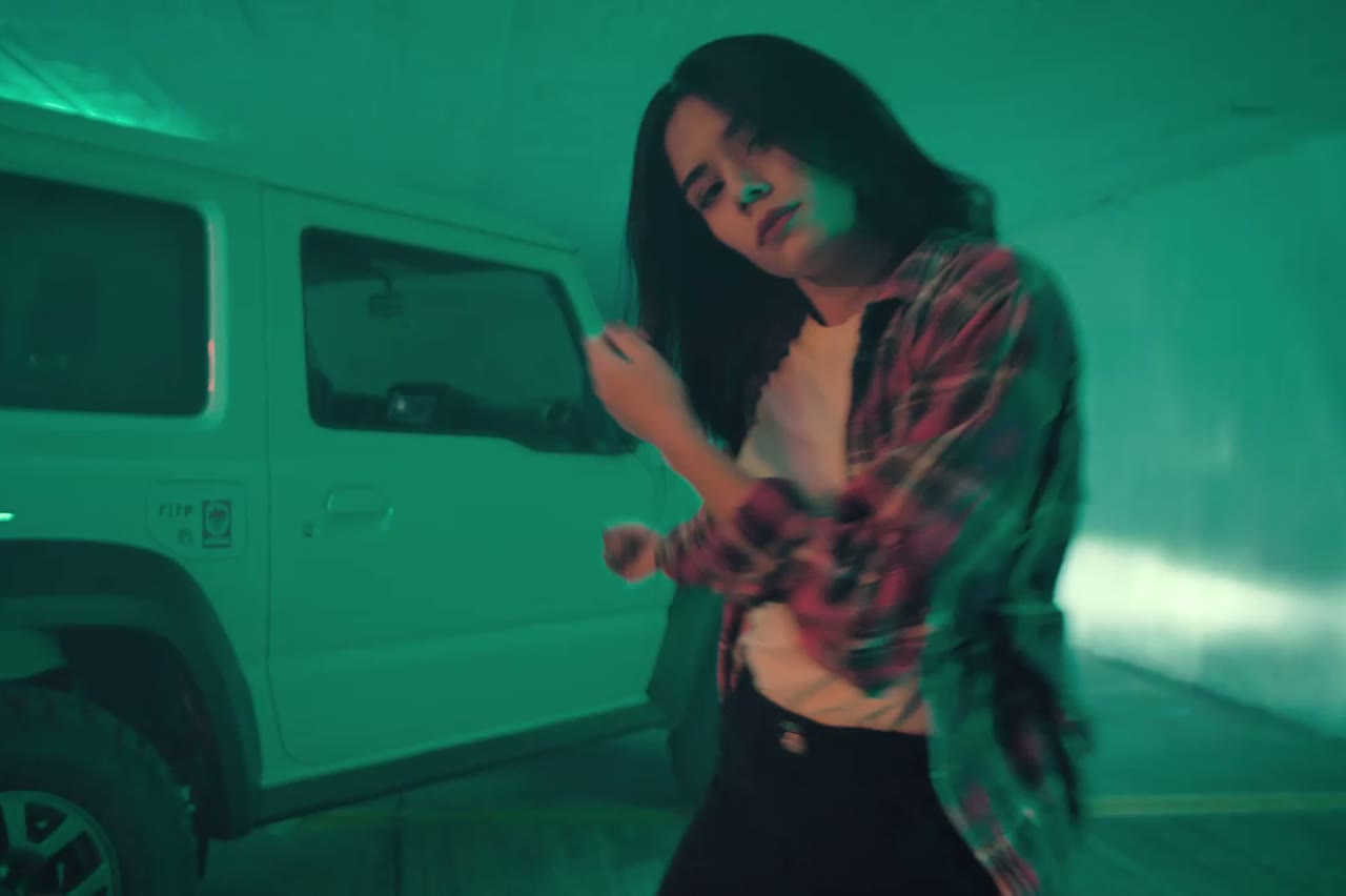 The same style of performer on a neon-lit stage, image to rap video result