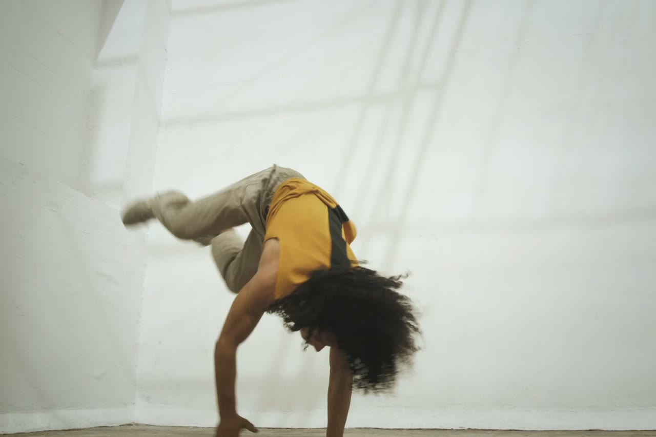 A group performing on a city block at dusk, cinematic text to rap video scene
